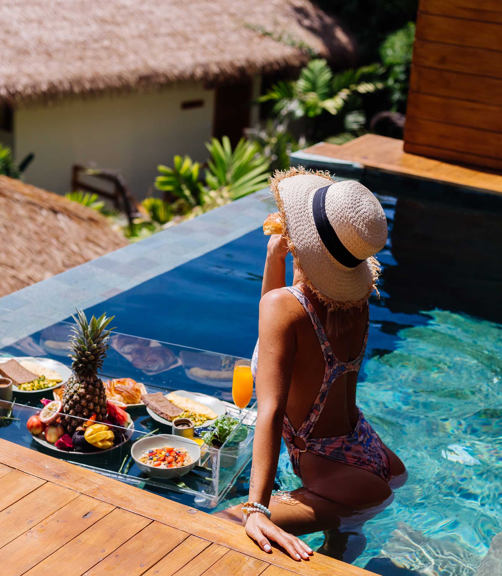 woman-in-bikini-and-straw-hat-with-floating.jpg